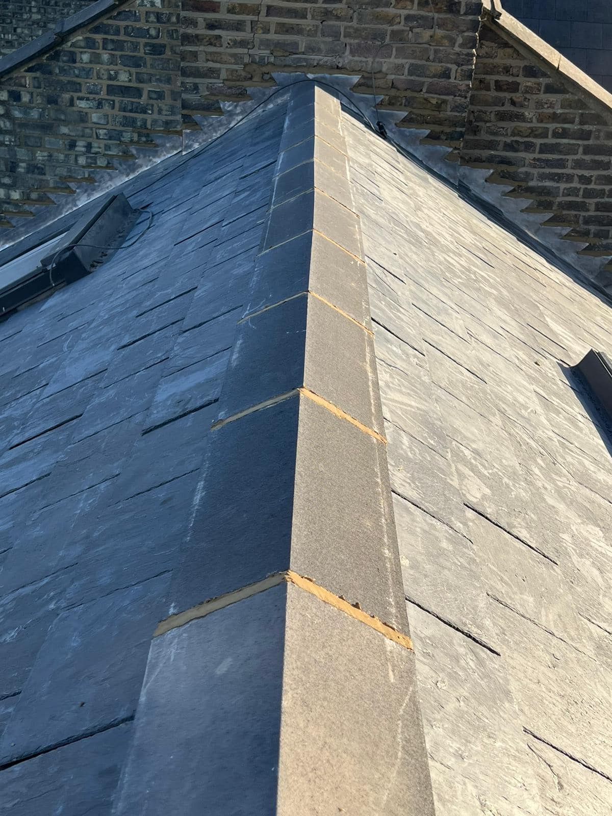 Professional roofers working on a property in London - KS Roof Master