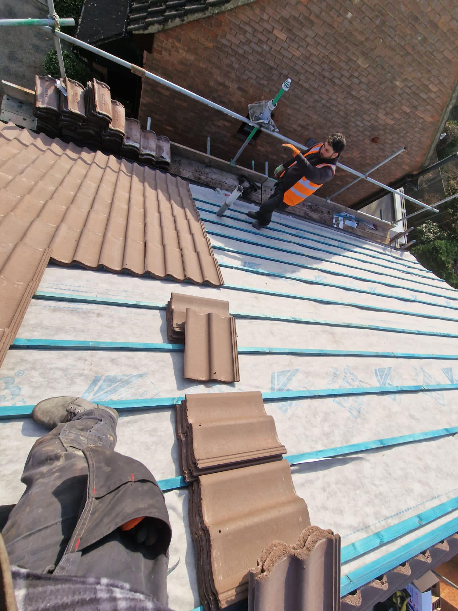 Professional roofers working on a property in London - KS Roof Master
