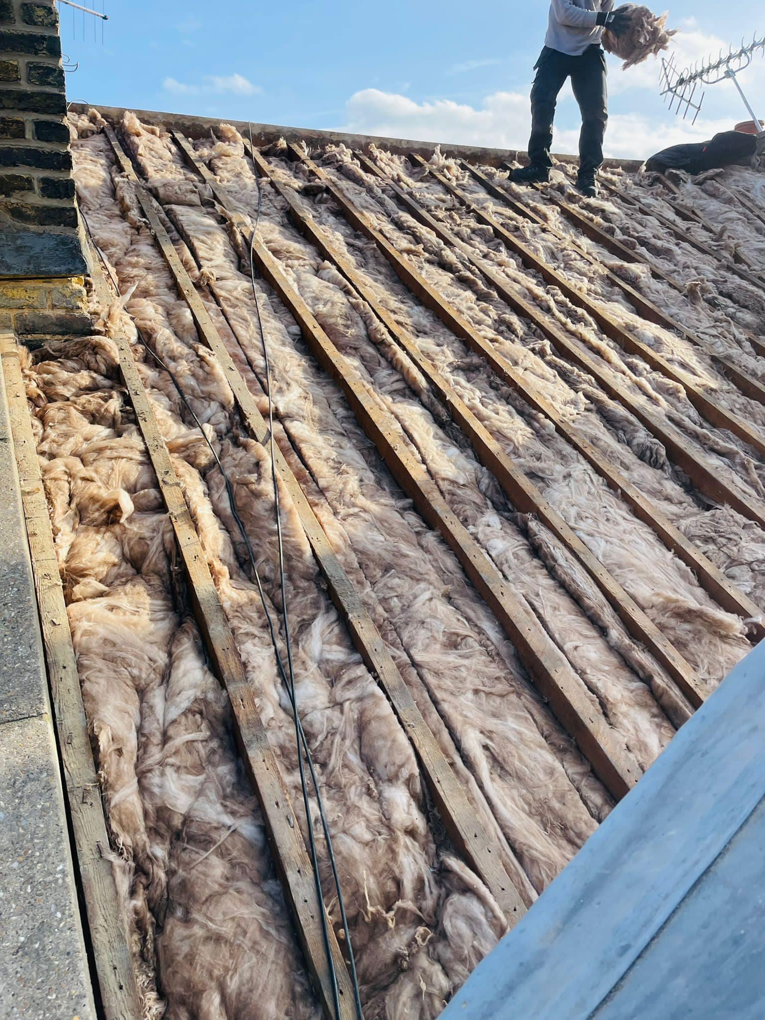 Professional roofers working on a property in London - KS Roof Master