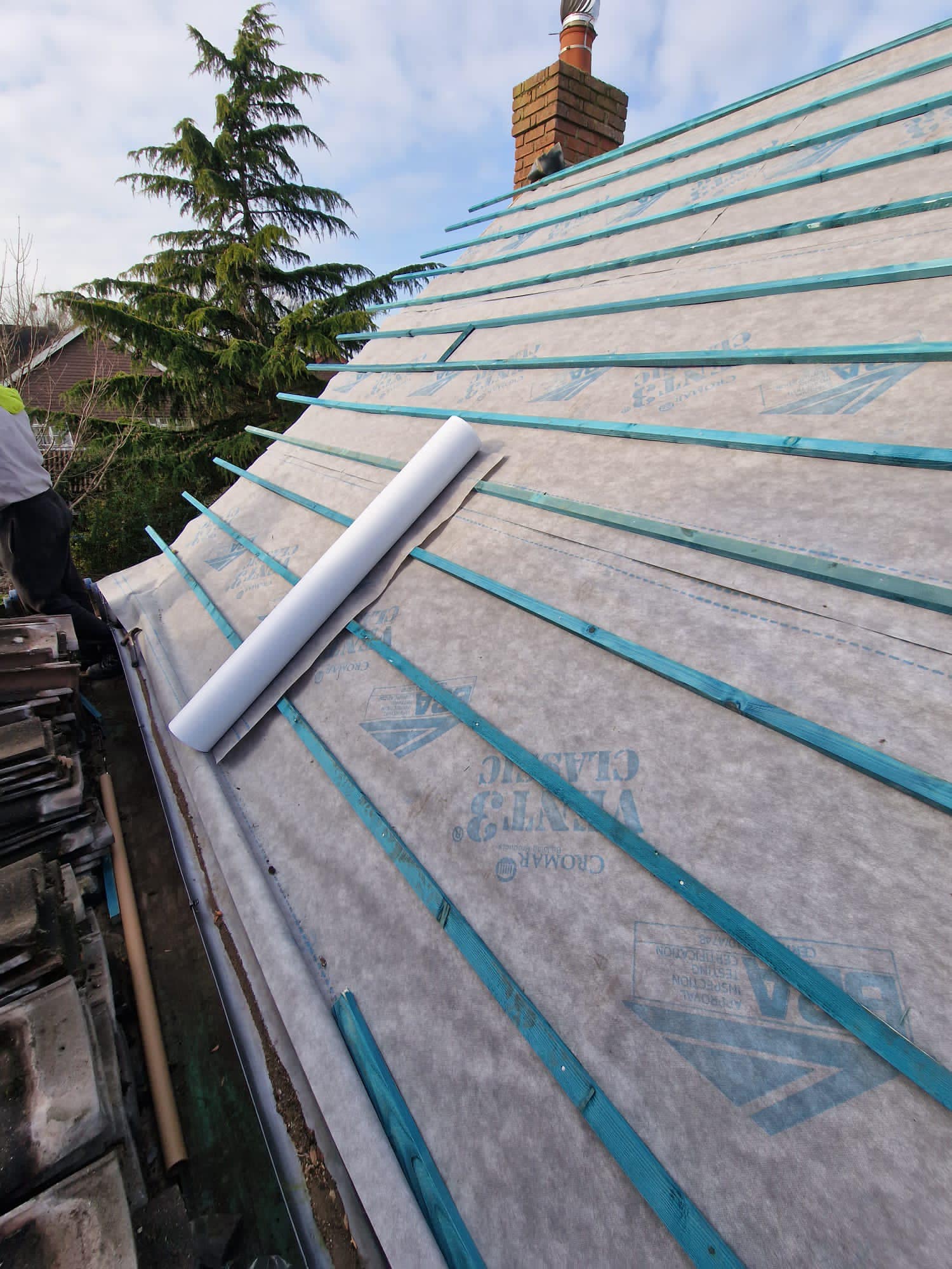 Professional roofers working on a property in London - KS Roof Master