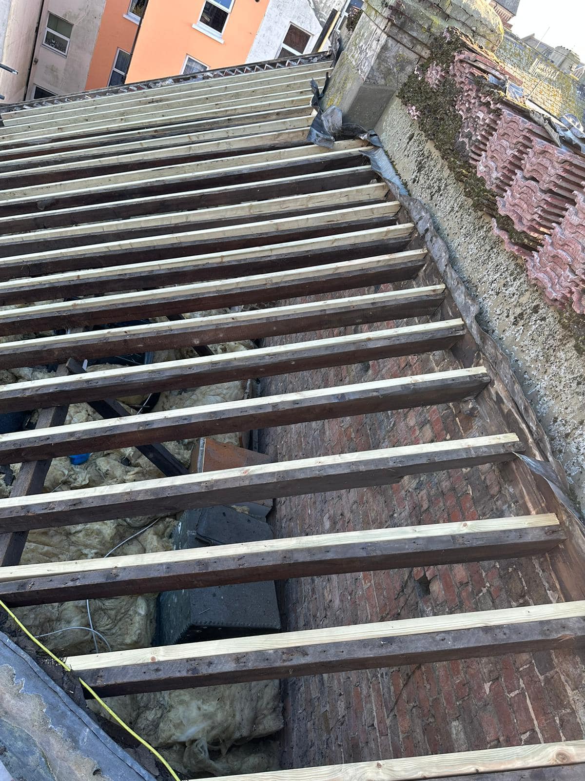 Professional roofers working on a property in London - KS Roof Master