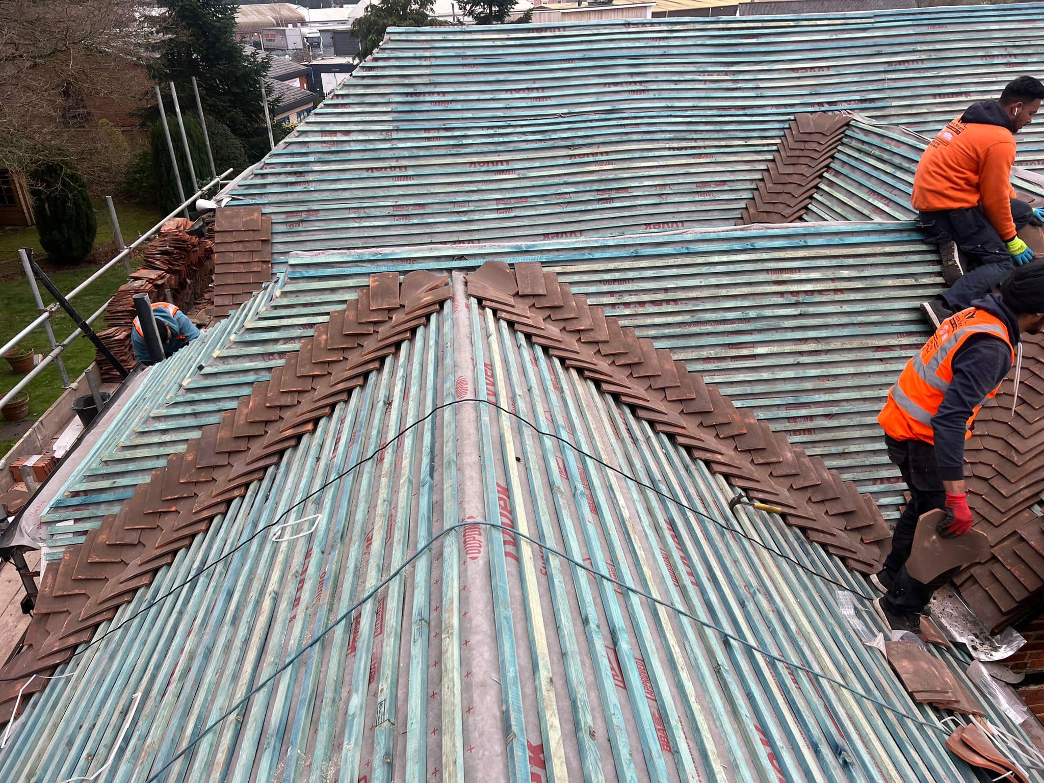 Professional roofers working on a property in London - KS Roof Master