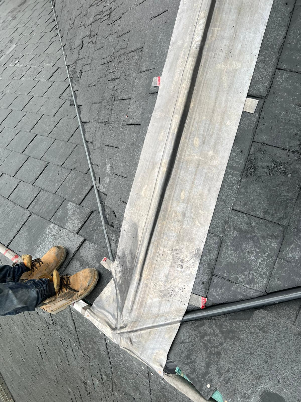 Professional roofers working on a property in London - KS Roof Master