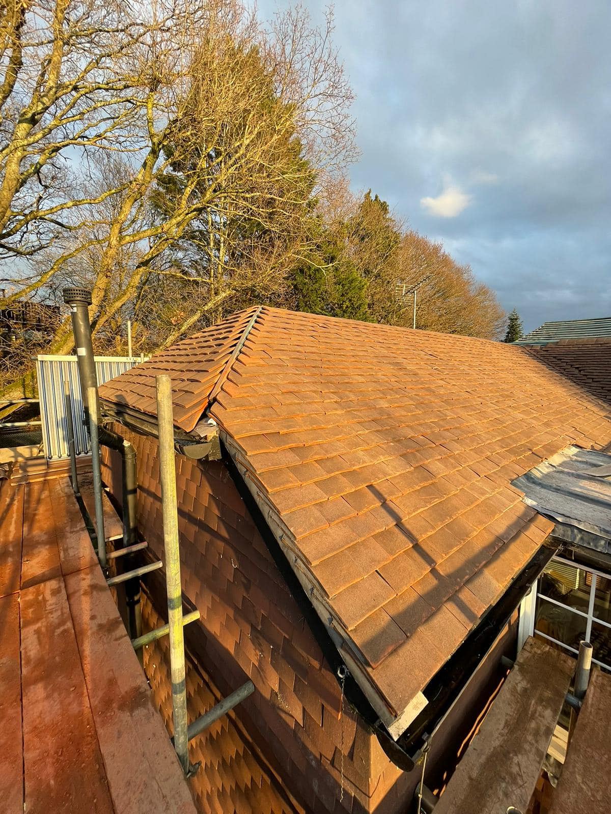 Professional roofers working on a property in London - KS Roof Master