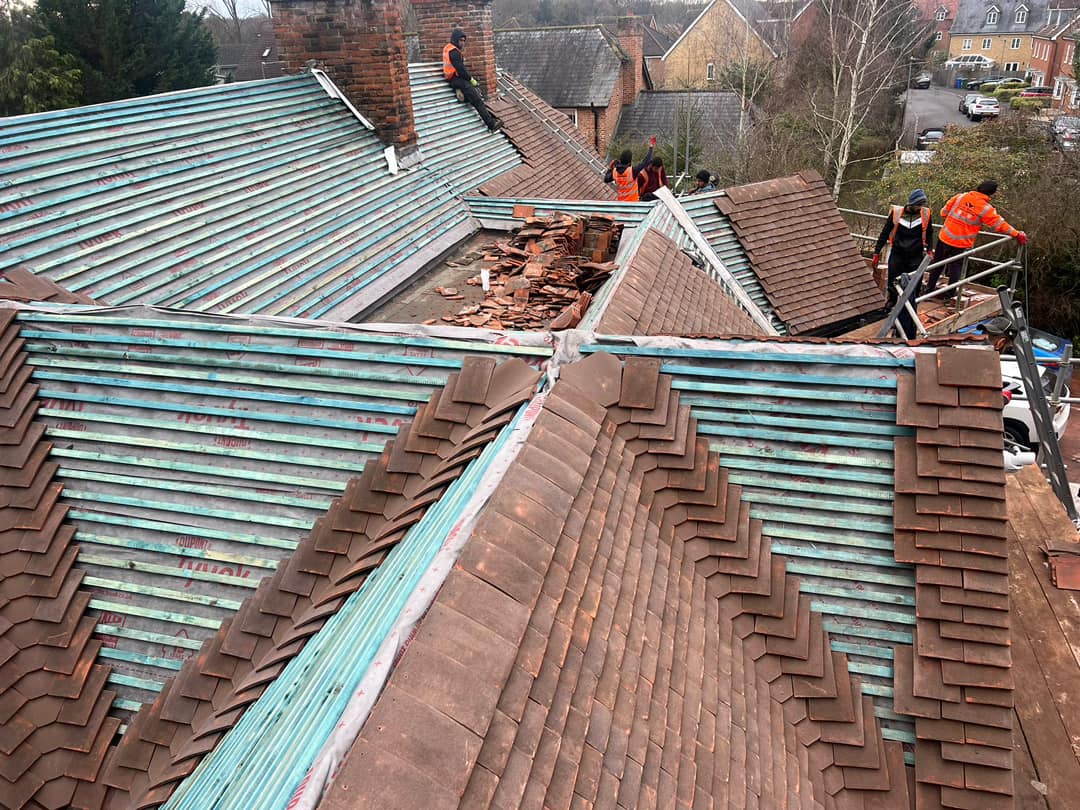 Professional roofers working on a property in London - KS Roof Master