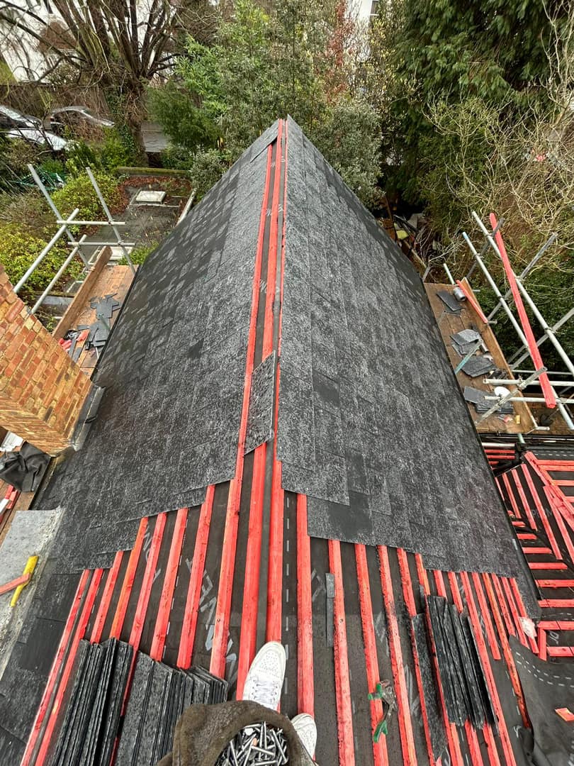 Professional roofers working on a property in London - KS Roof Master