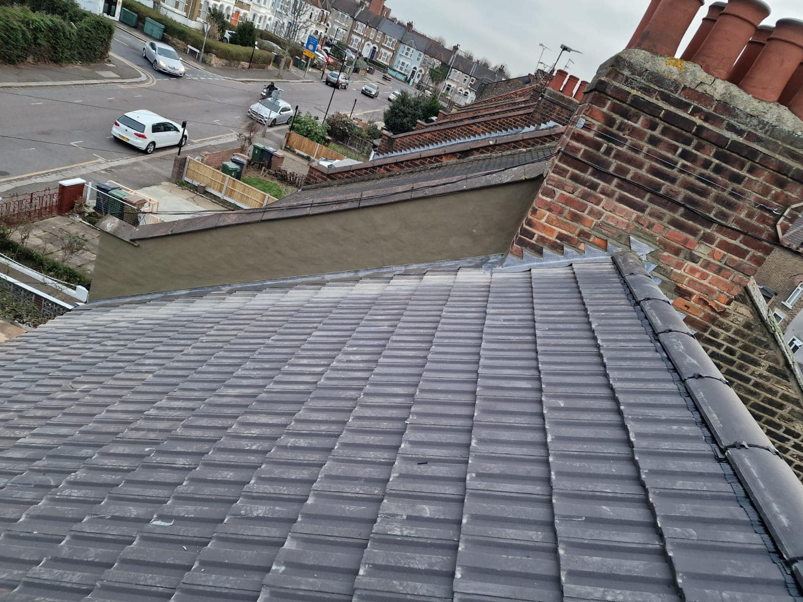 Professional roofers working on a property in London - KS Roof Master