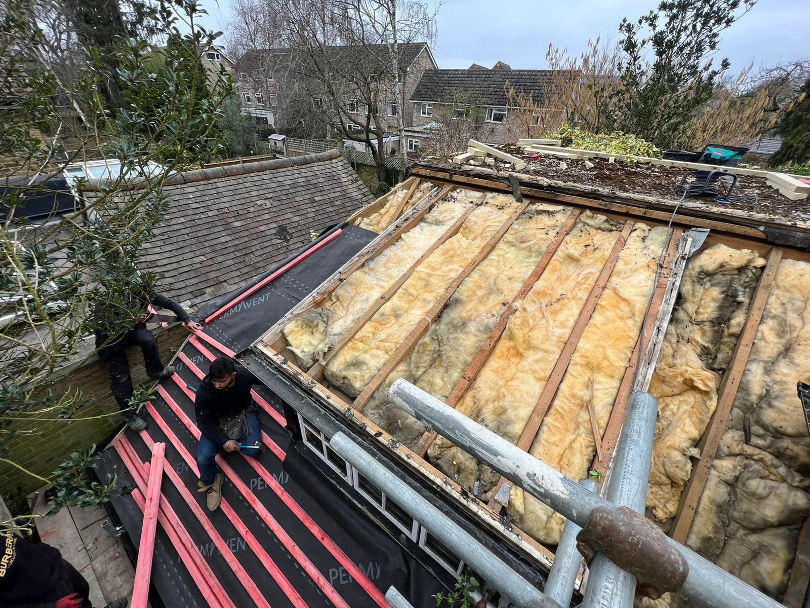 Professional roofers working on a property in London - KS Roof Master