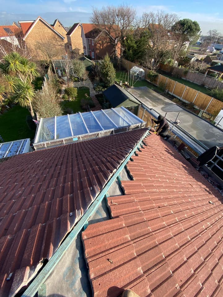 Professional roofers working on a property in London - KS Roof Master