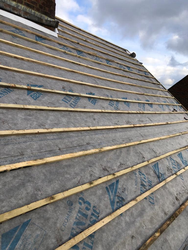 Professional roofers working on a property in London - KS Roof Master