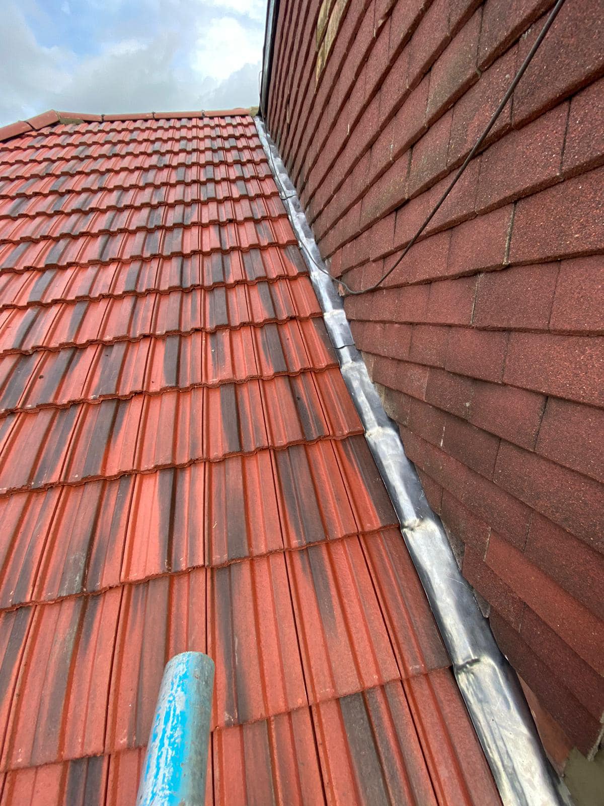 Professional roofers working on a property in London - KS Roof Master