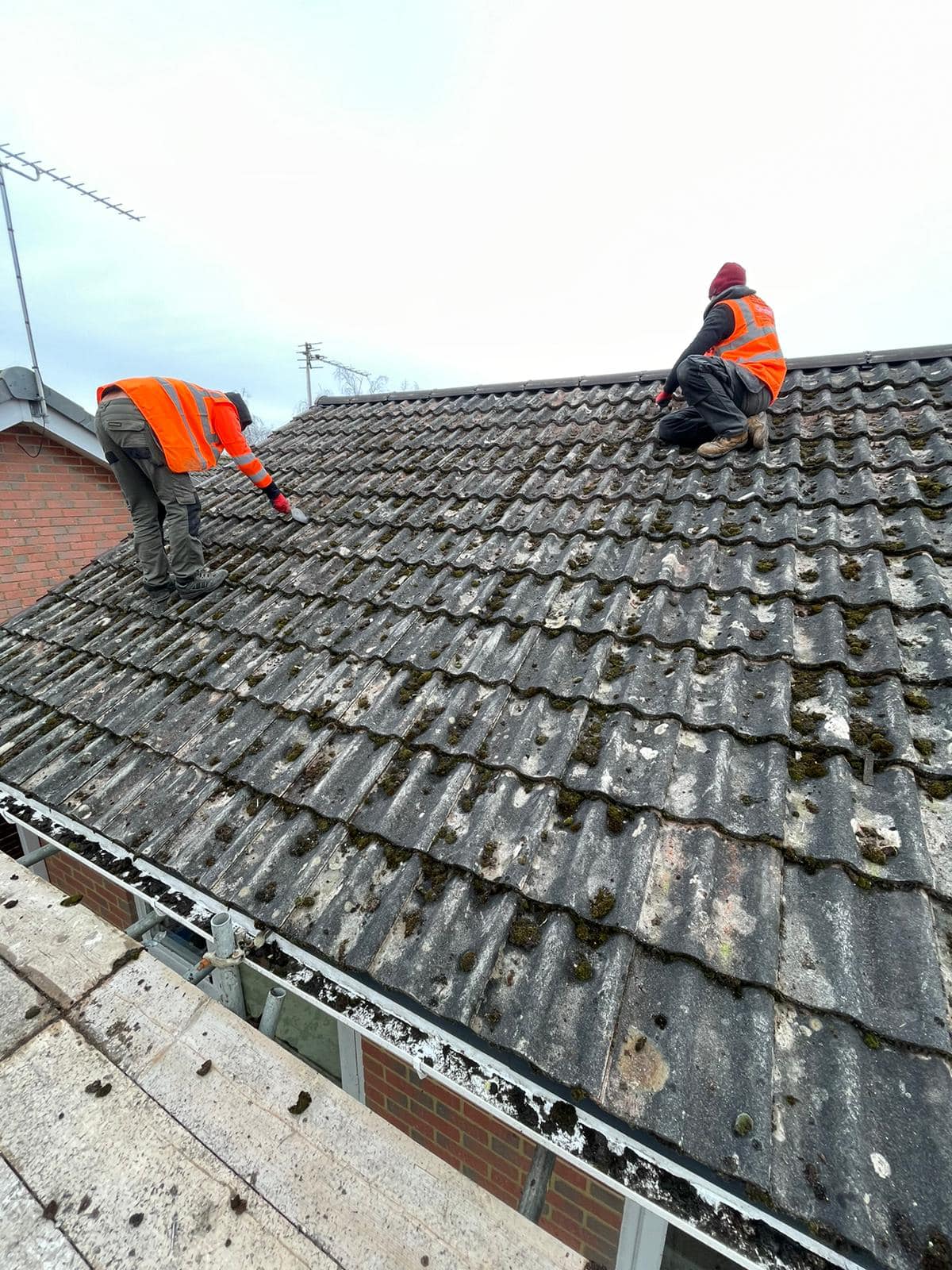 Professional roofers working on a property in London - KS Roof Master