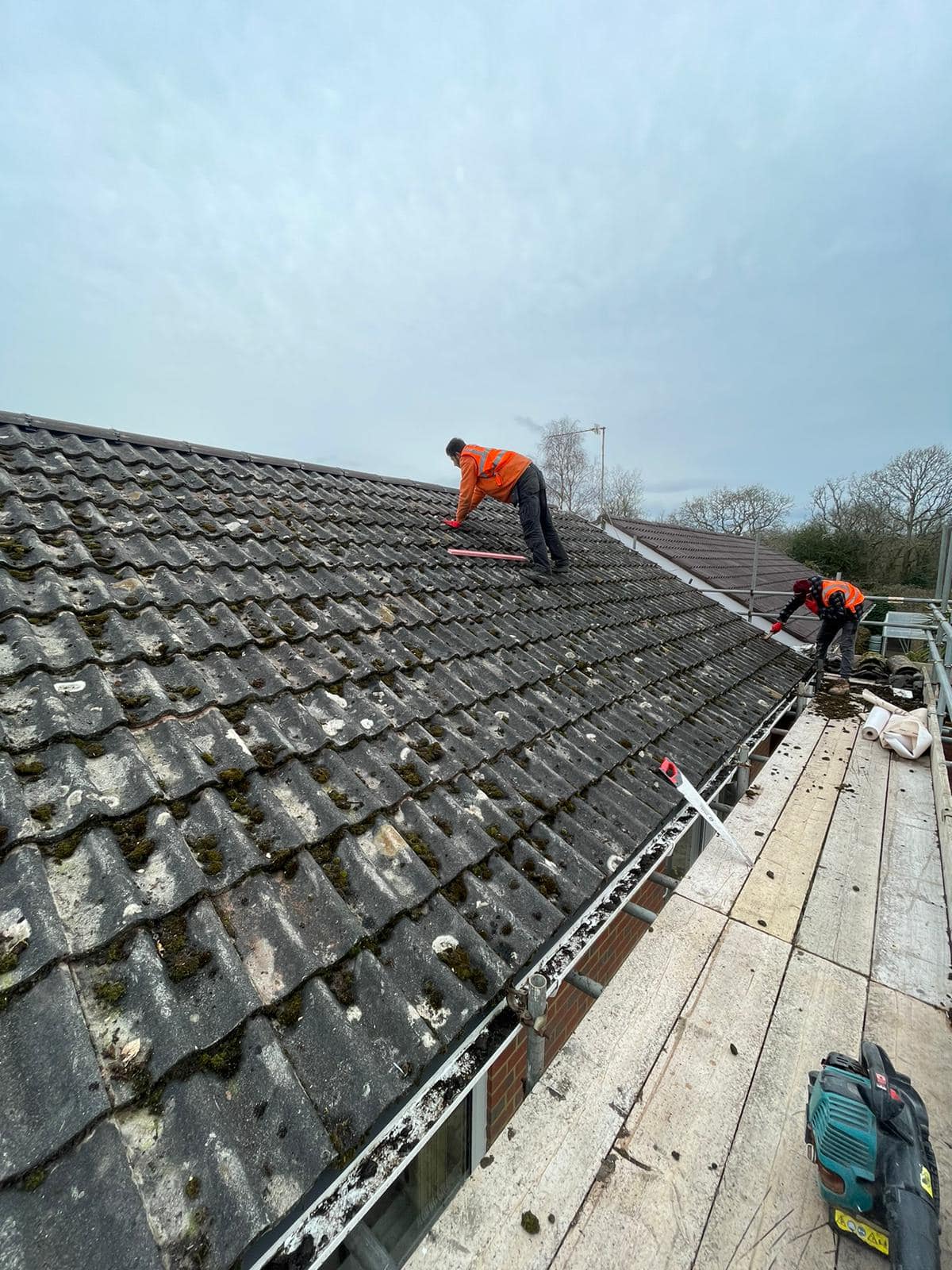 Professional roofers working on a property in London - KS Roof Master