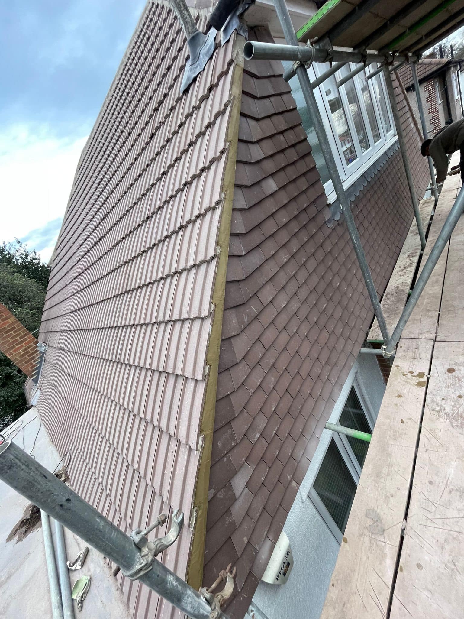 Professional roofers working on a property in London - KS Roof Master