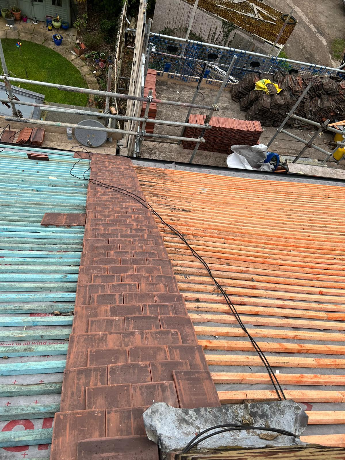 Professional roofers working on a property in London - KS Roof Master