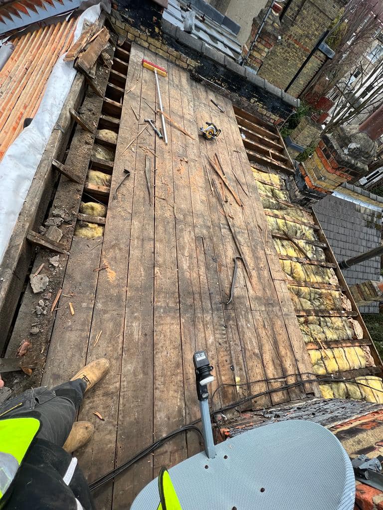 Professional roofers working on a property in London - KS Roof Master