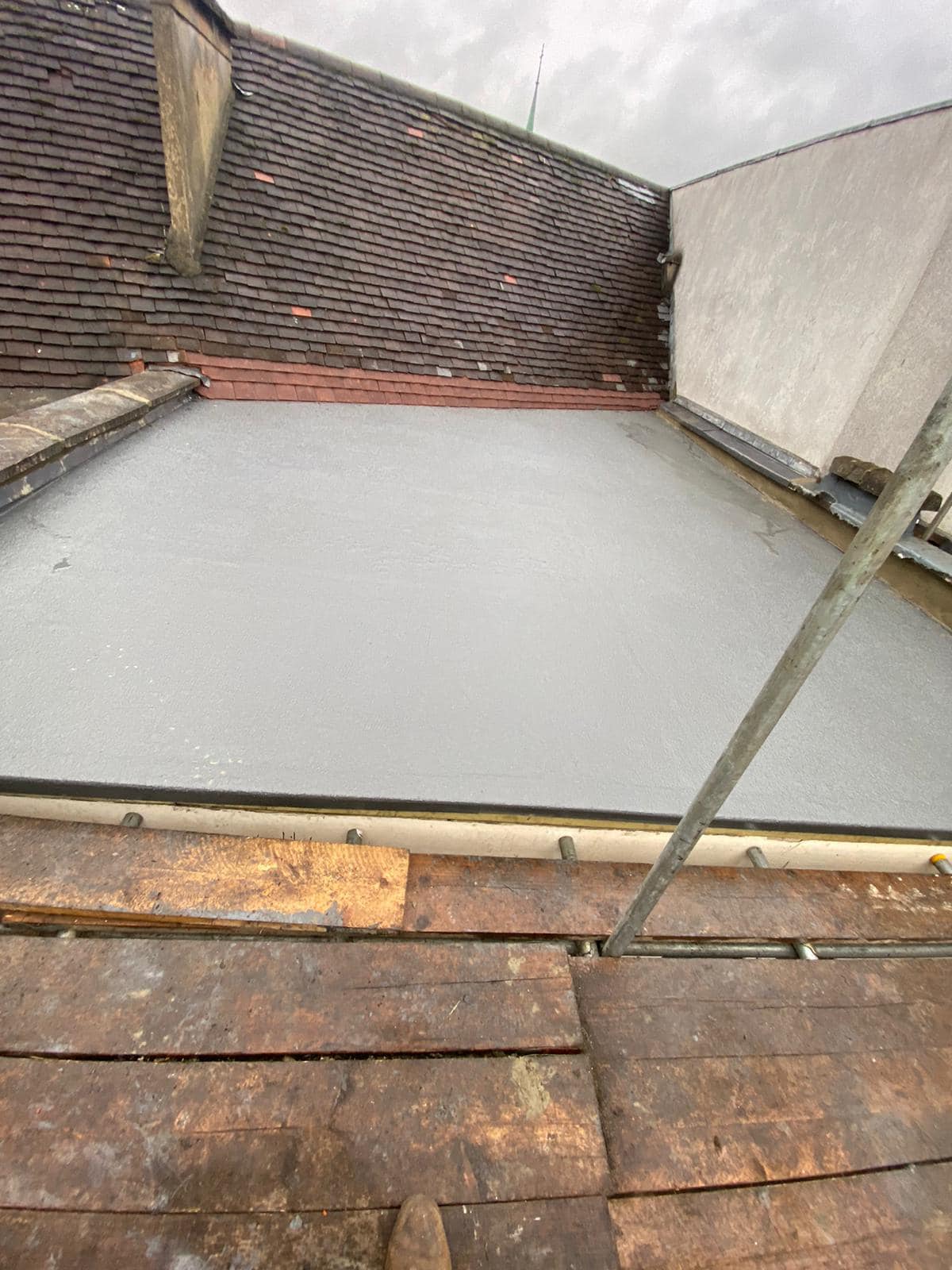 Professional roofers working on a property in London - KS Roof Master