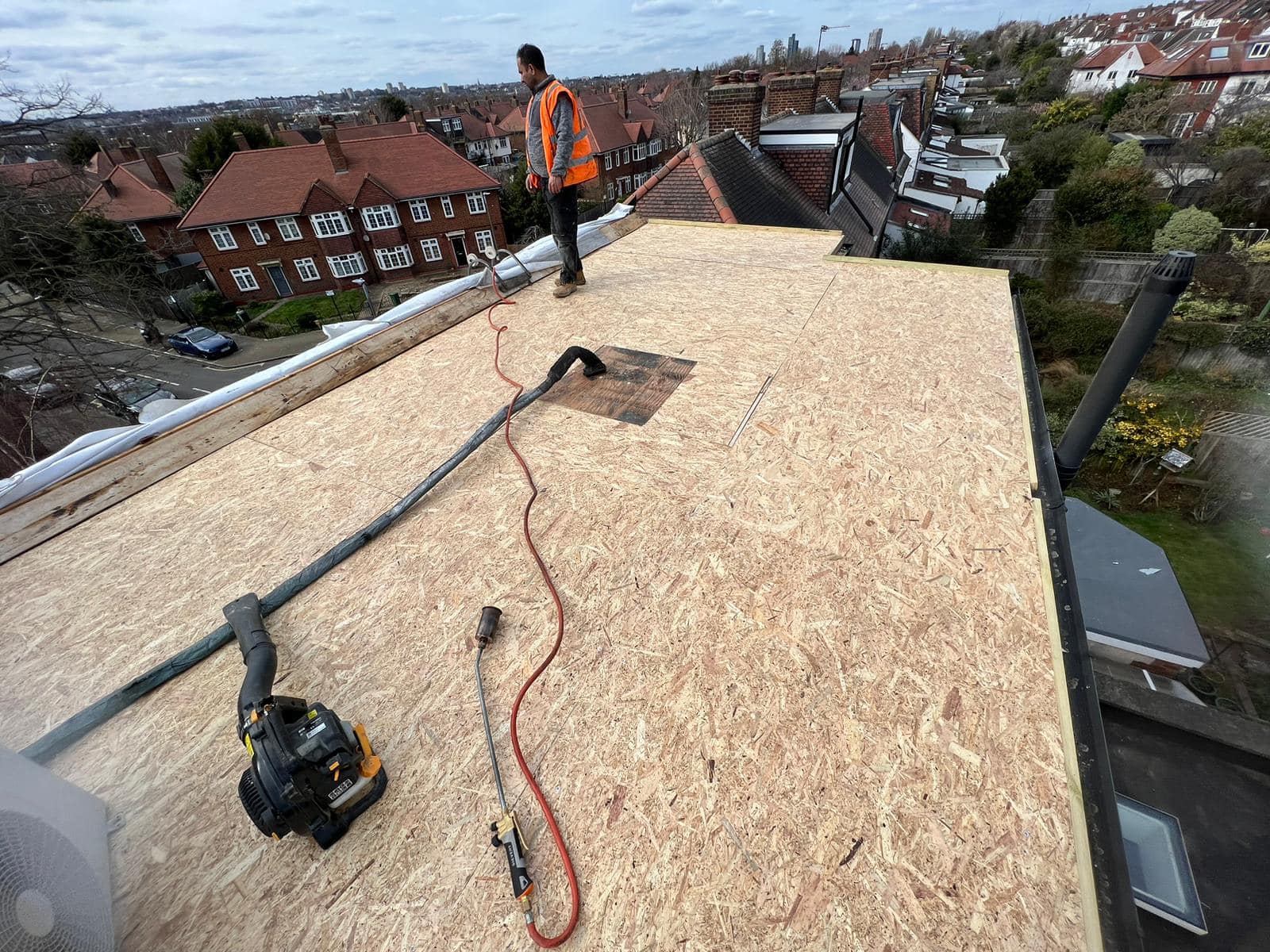 Professional roofers working on a property in London - KS Roof Master