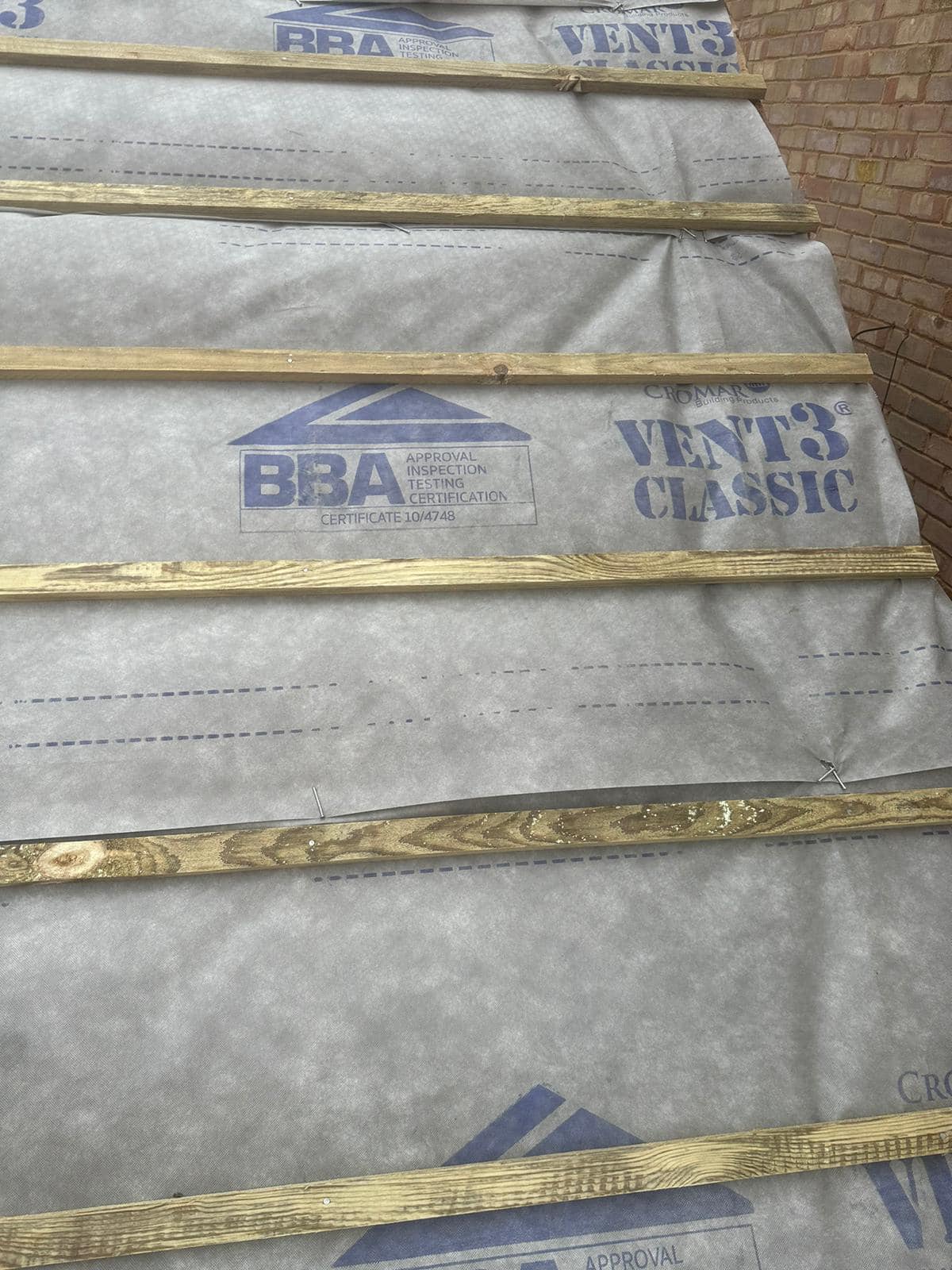 Professional roofers working on a property in London - KS Roof Master