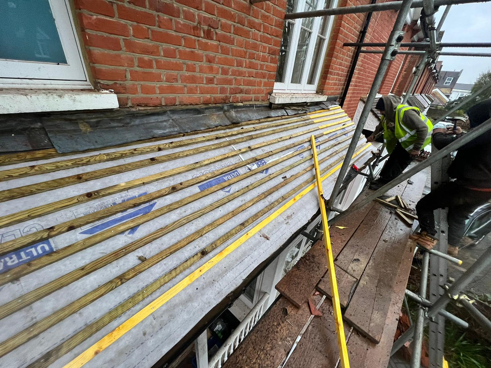 Professional roofers working on a property in London - KS Roof Master