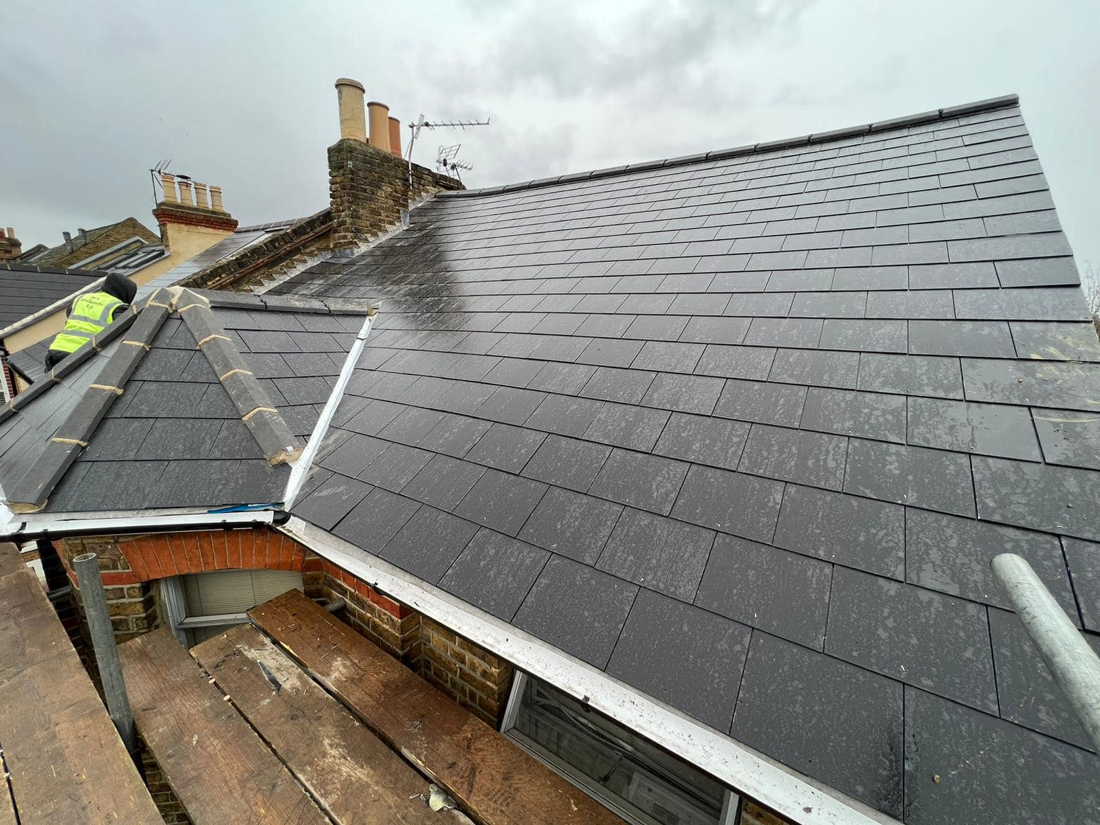 Professional roofers working on a property in London - KS Roof Master