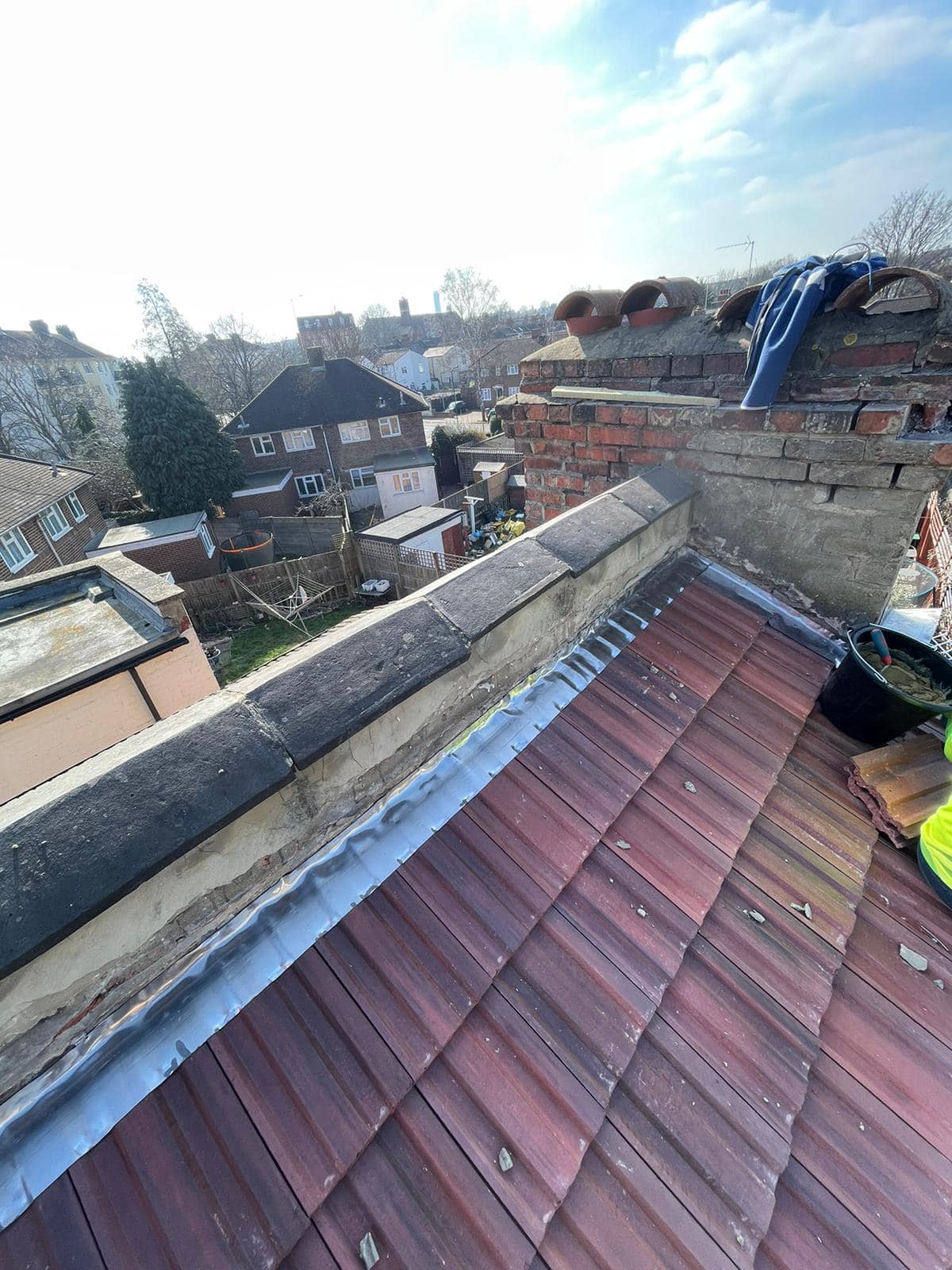 Professional roofers working on a property in London - KS Roof Master