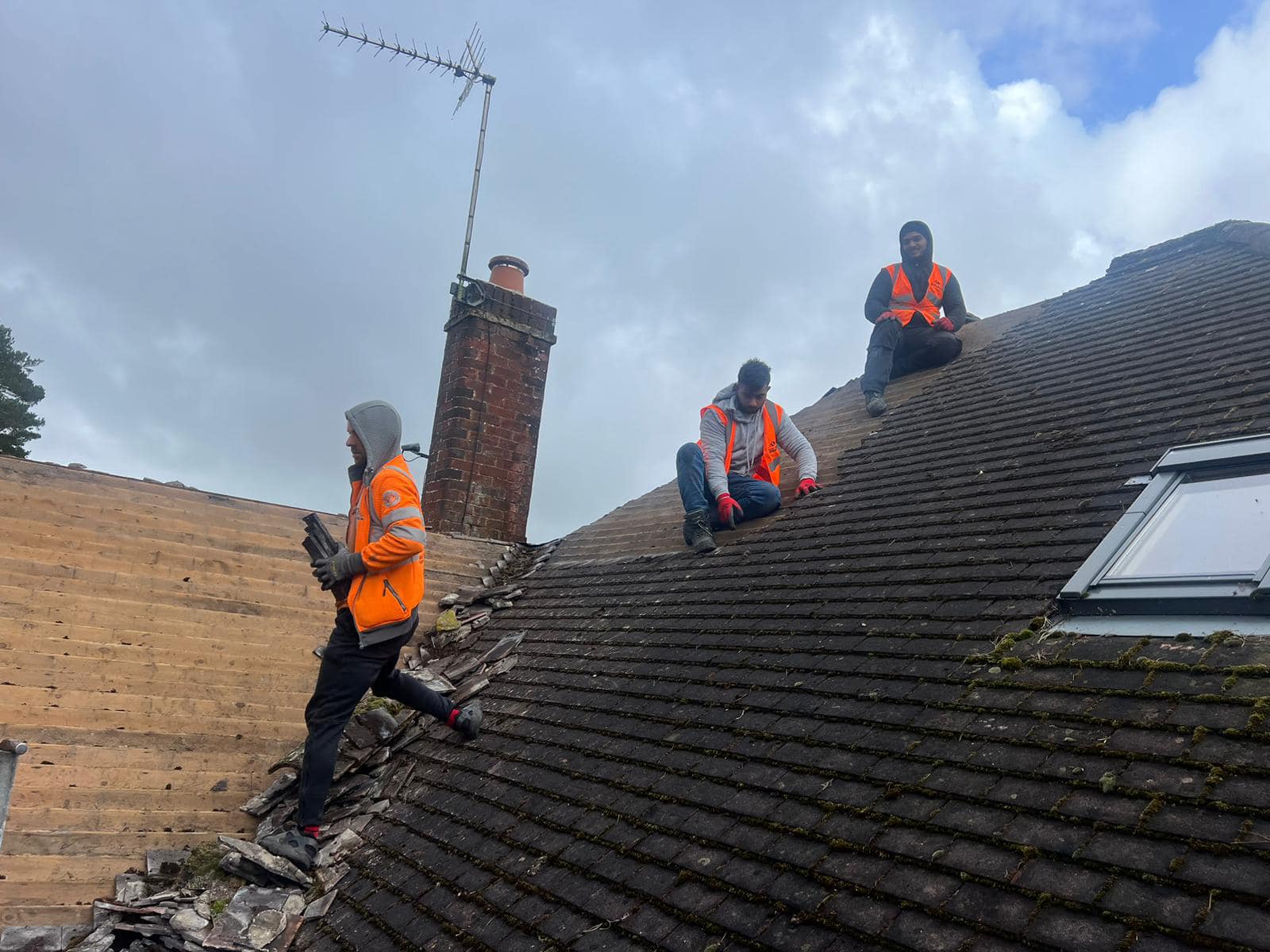 Professional roofers working on a property in London - KS Roof Master