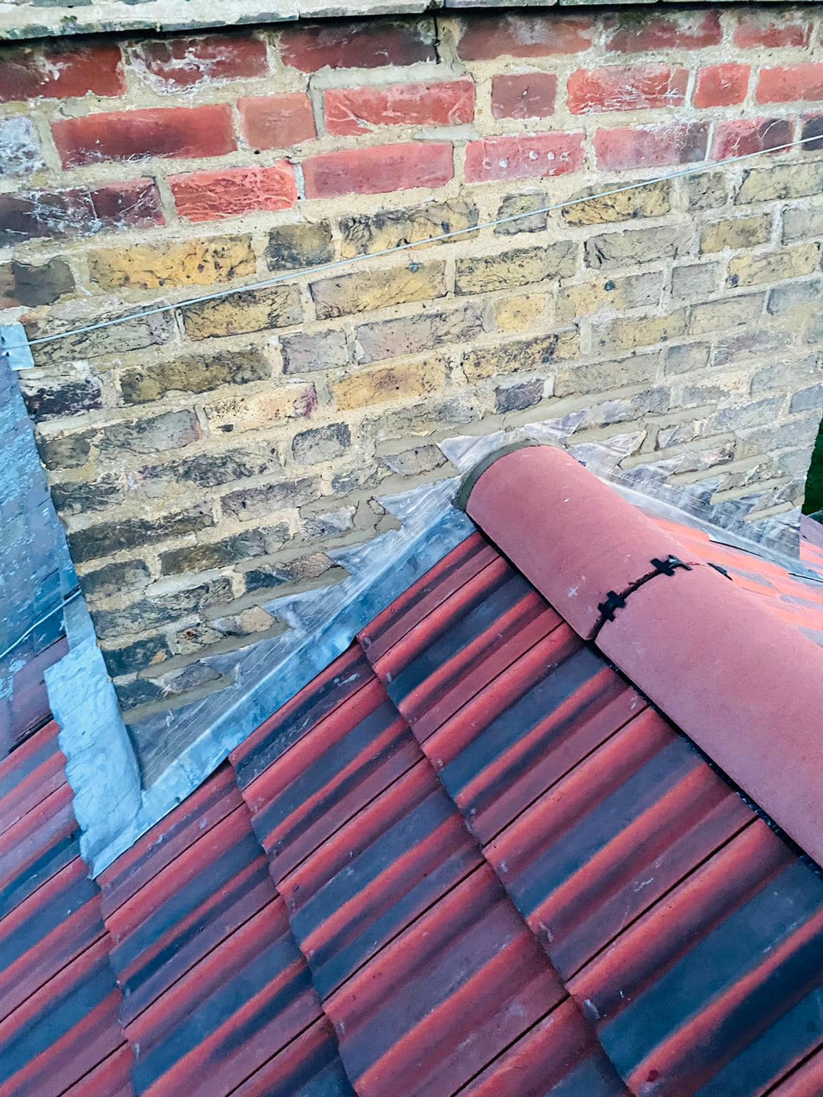 Professional roofers working on a property in London - KS Roof Master