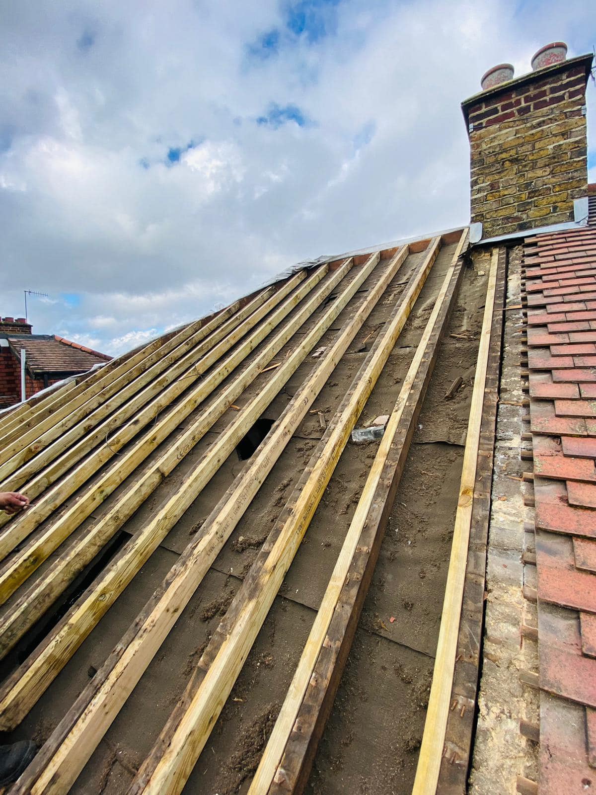 Professional roofers working on a property in London - KS Roof Master