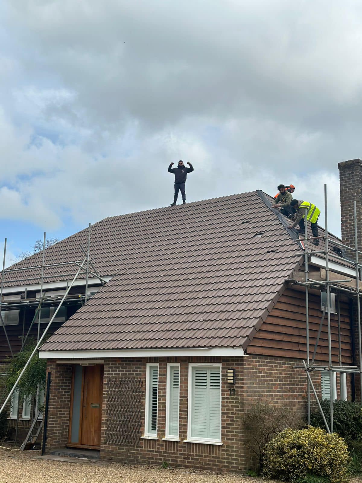 Professional roofers working on a property in London - KS Roof Master