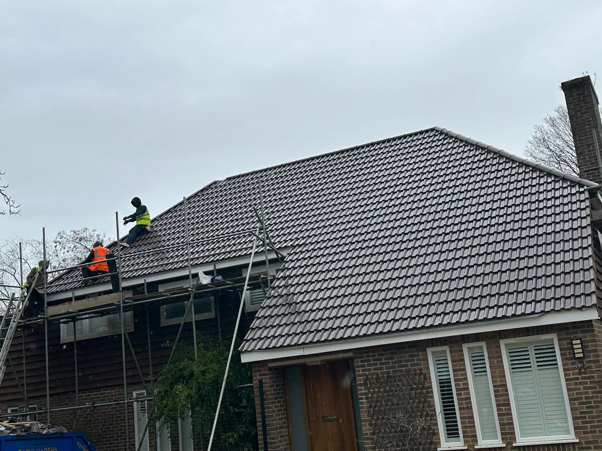 Professional roofers working on a property in London - KS Roof Master