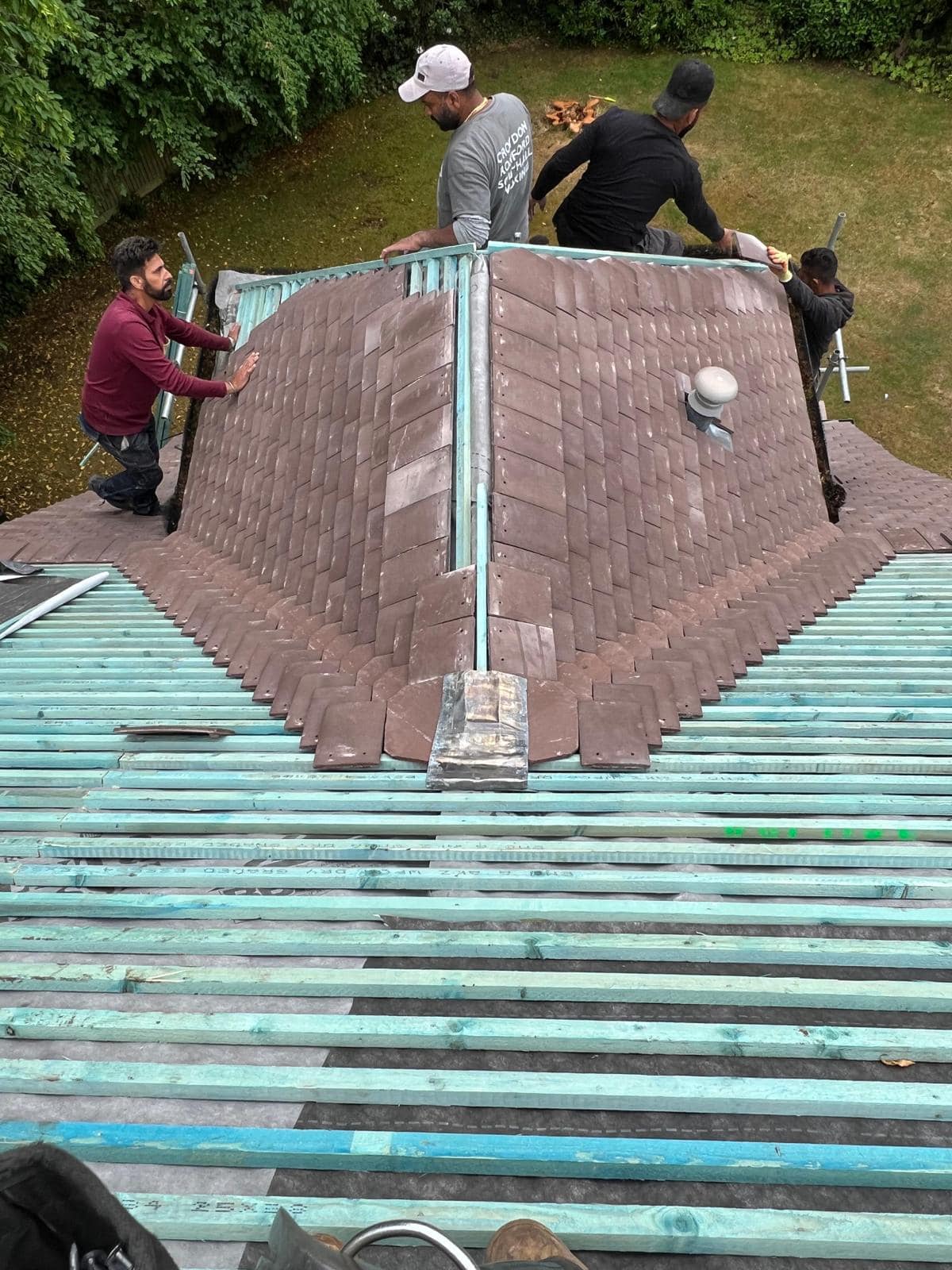 Professional roofers working on a property in London - KS Roof Master