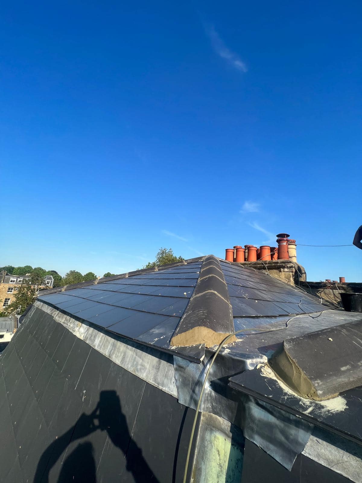 Professional roofers working on a property in London - KS Roof Master