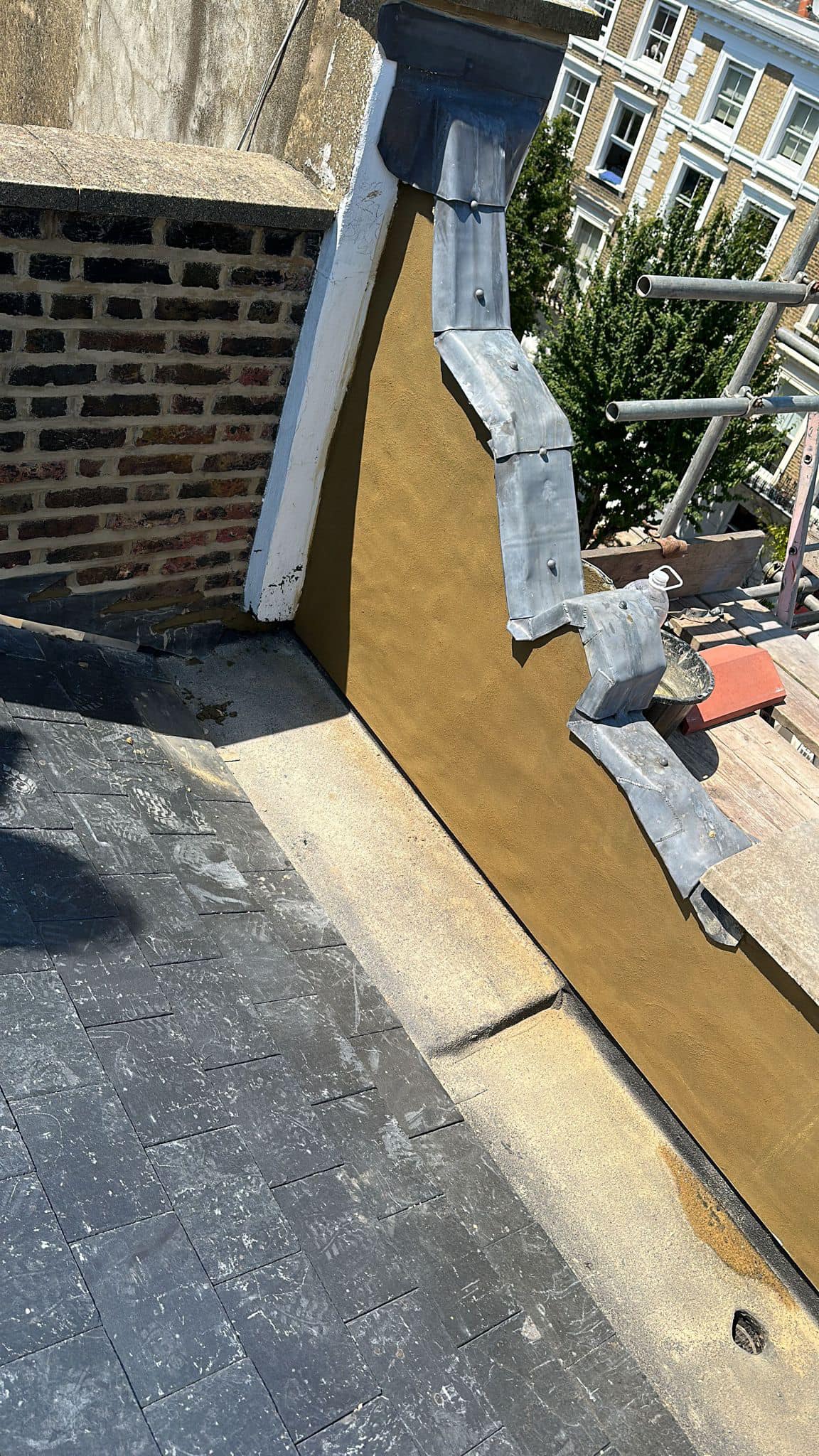 Professional roofers working on a property in London - KS Roof Master