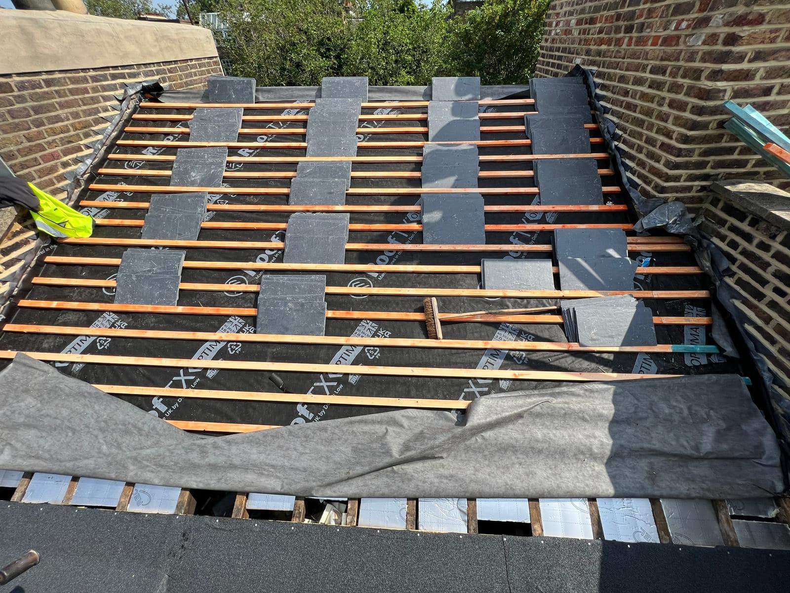 Professional roofers working on a property in London - KS Roof Master