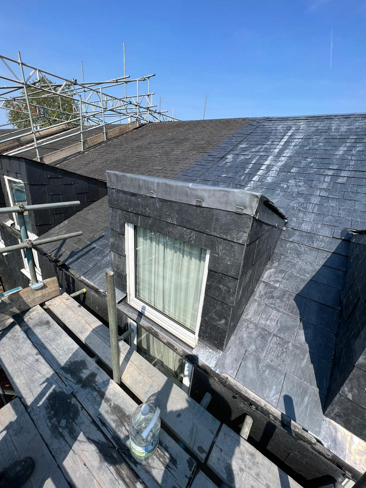 Professional roofers working on a property in London - KS Roof Master