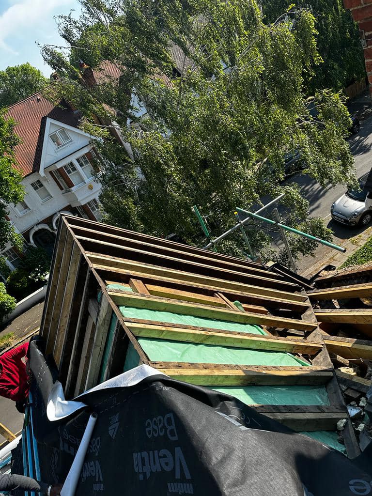 Professional roofers working on a property in London - KS Roof Master