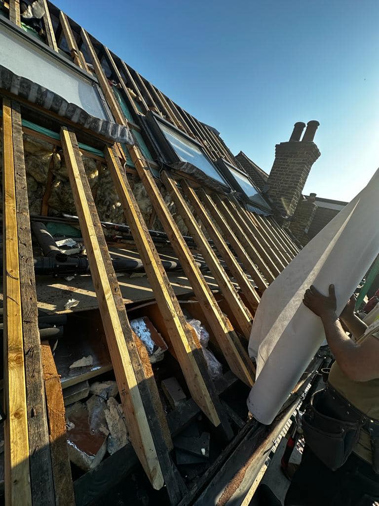 Professional roofers working on a property in London - KS Roof Master