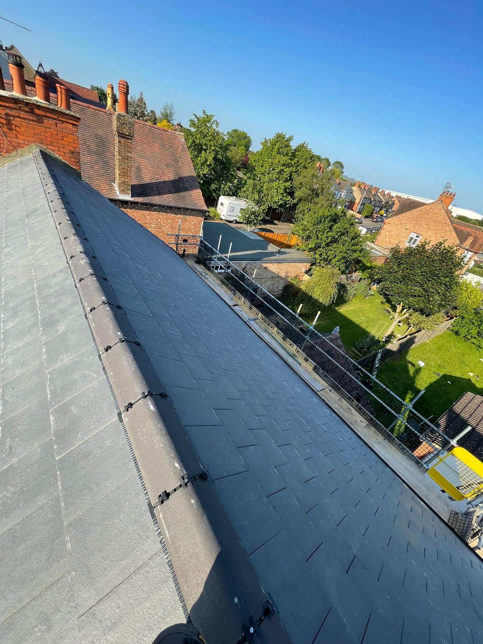 Professional roofers working on a property in London - KS Roof Master