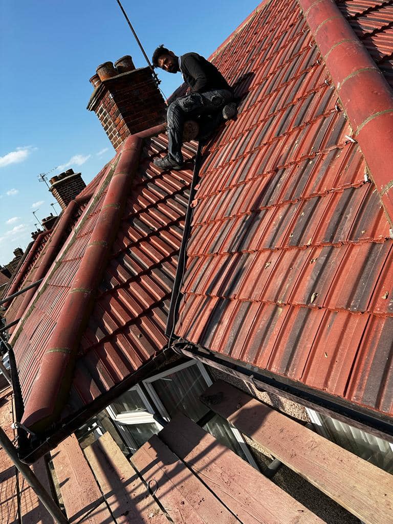 Professional roofers working on a property in London - KS Roof Master