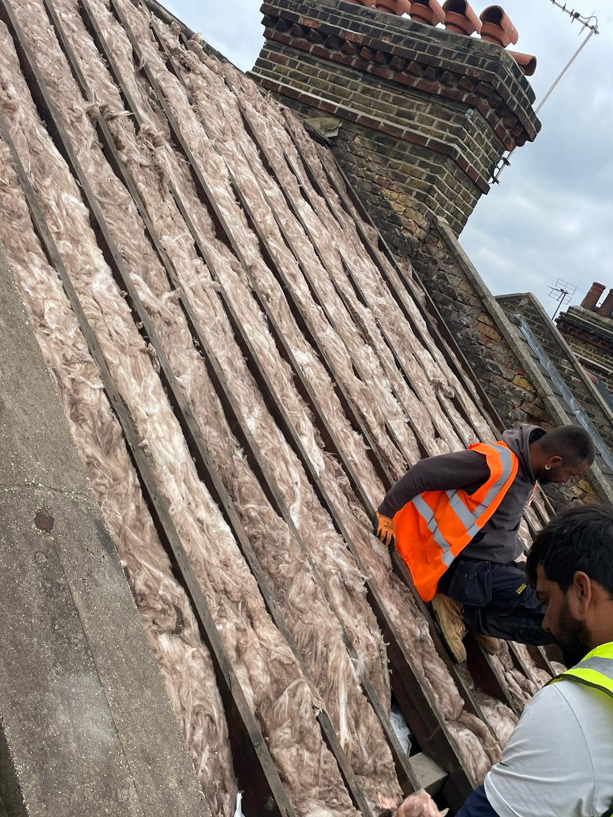 Professional roofers working on a property in London - KS Roof Master