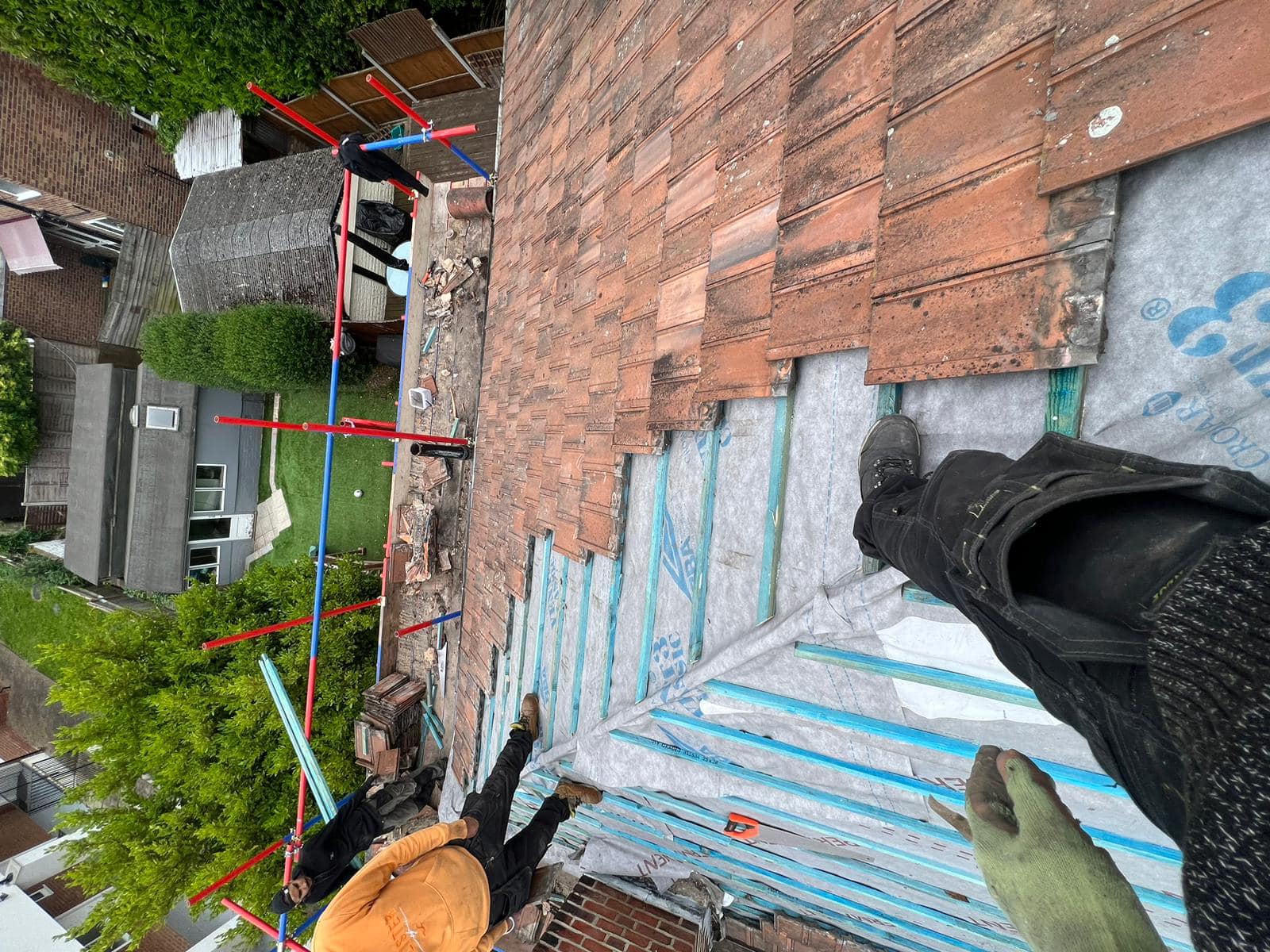 Professional roofers working on a property in London - KS Roof Master