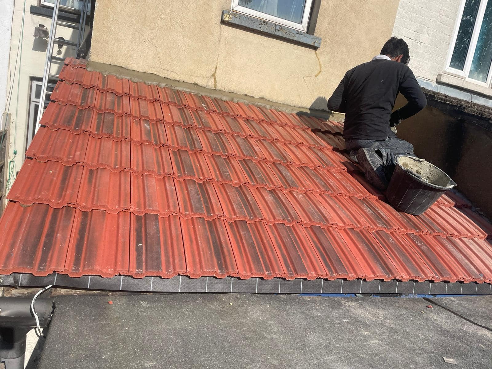 Professional roofers working on a property in London - KS Roof Master