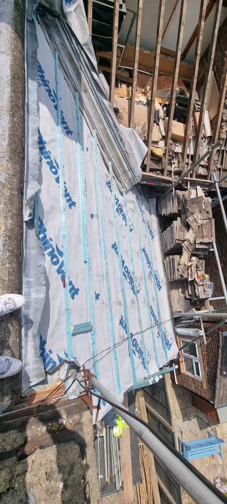 Professional roofers working on a property in London - KS Roof Master