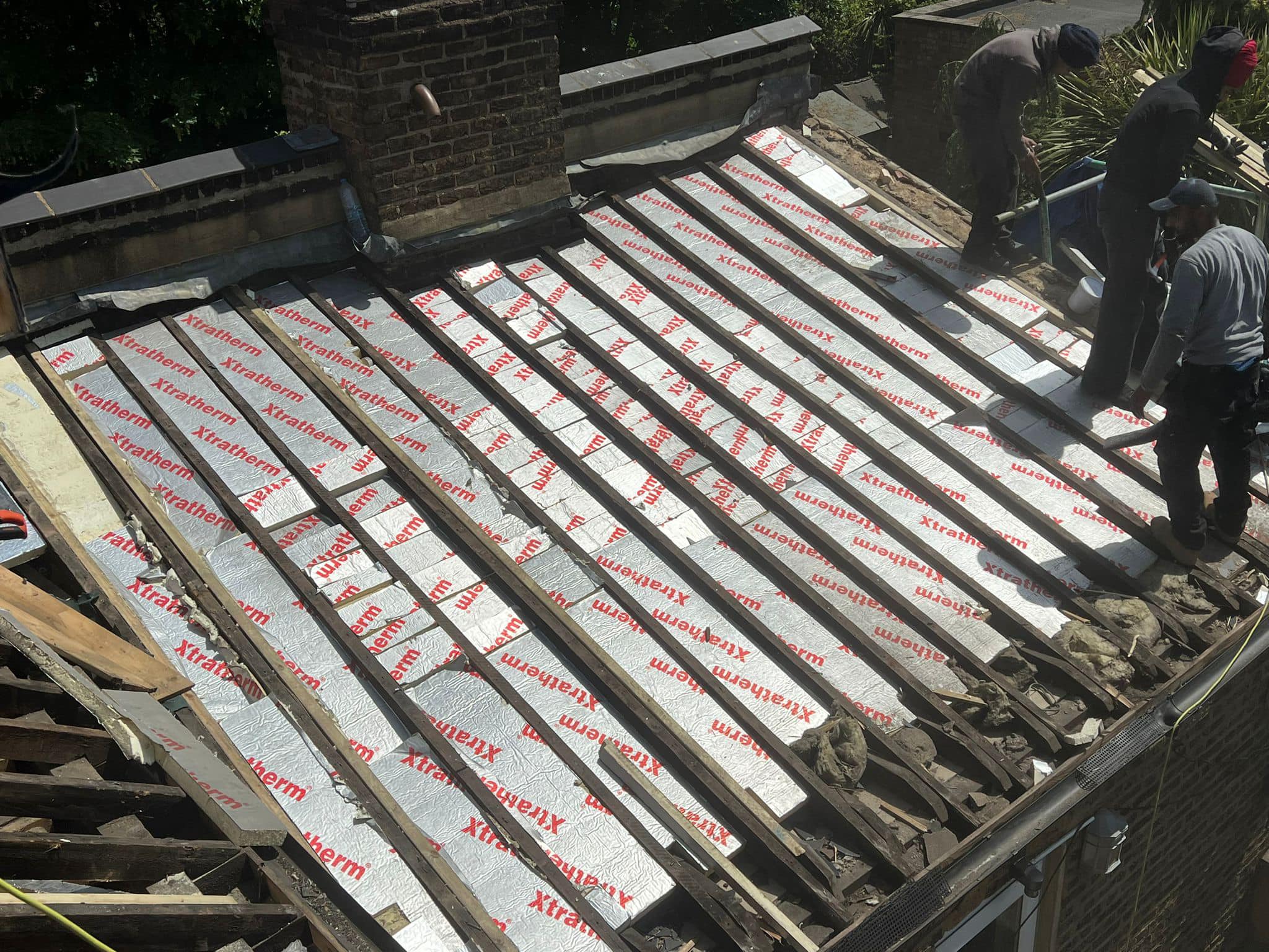 Professional roofers working on a property in London - KS Roof Master