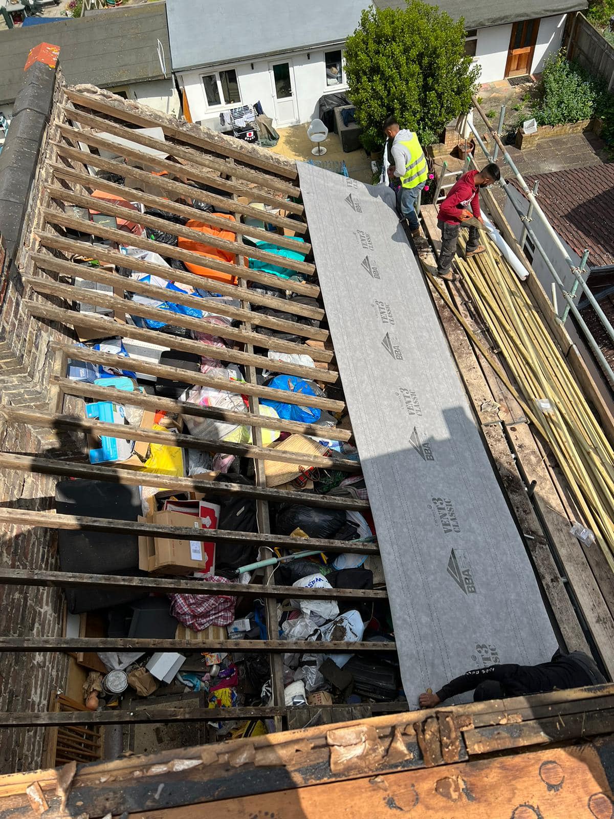 Professional roofers working on a property in London - KS Roof Master