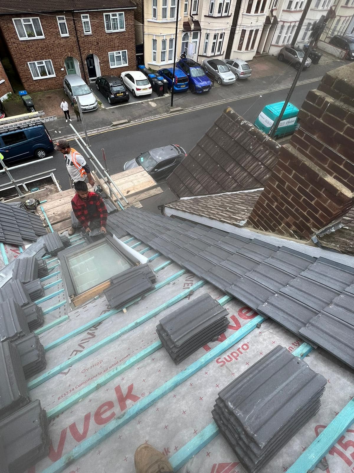 Professional roofers working on a property in London - KS Roof Master