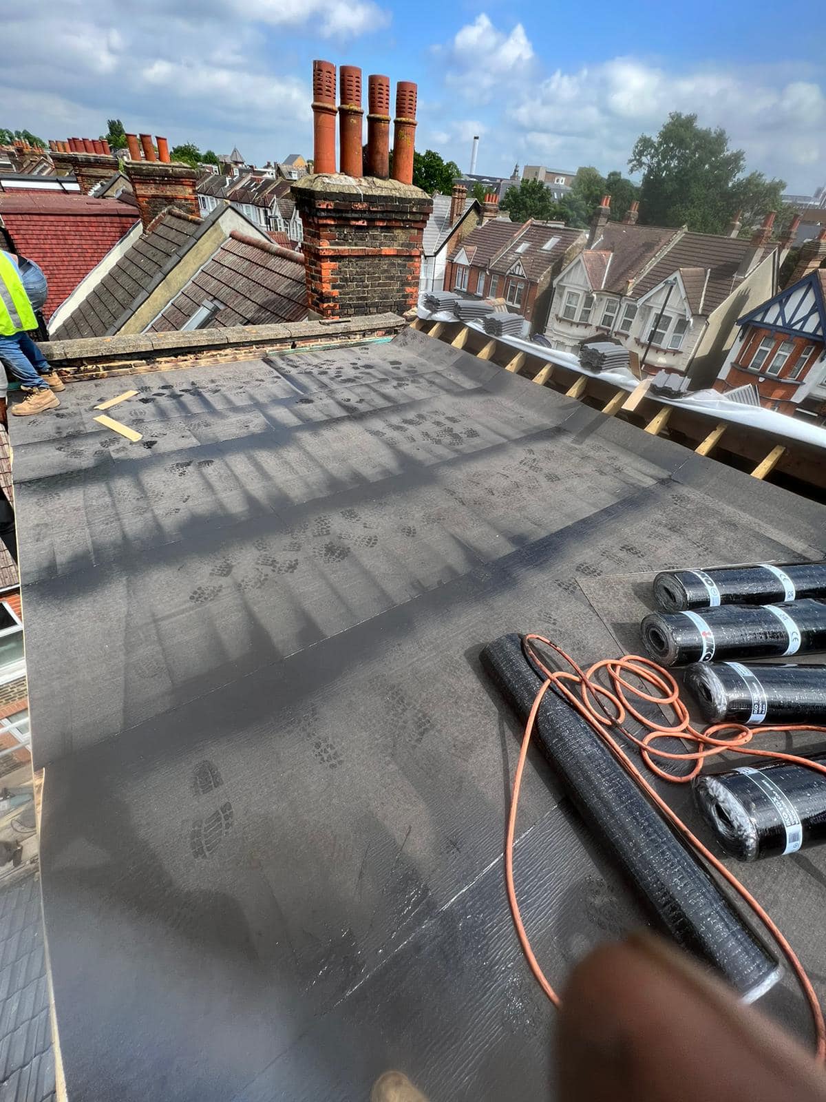 Professional roofers working on a property in London - KS Roof Master