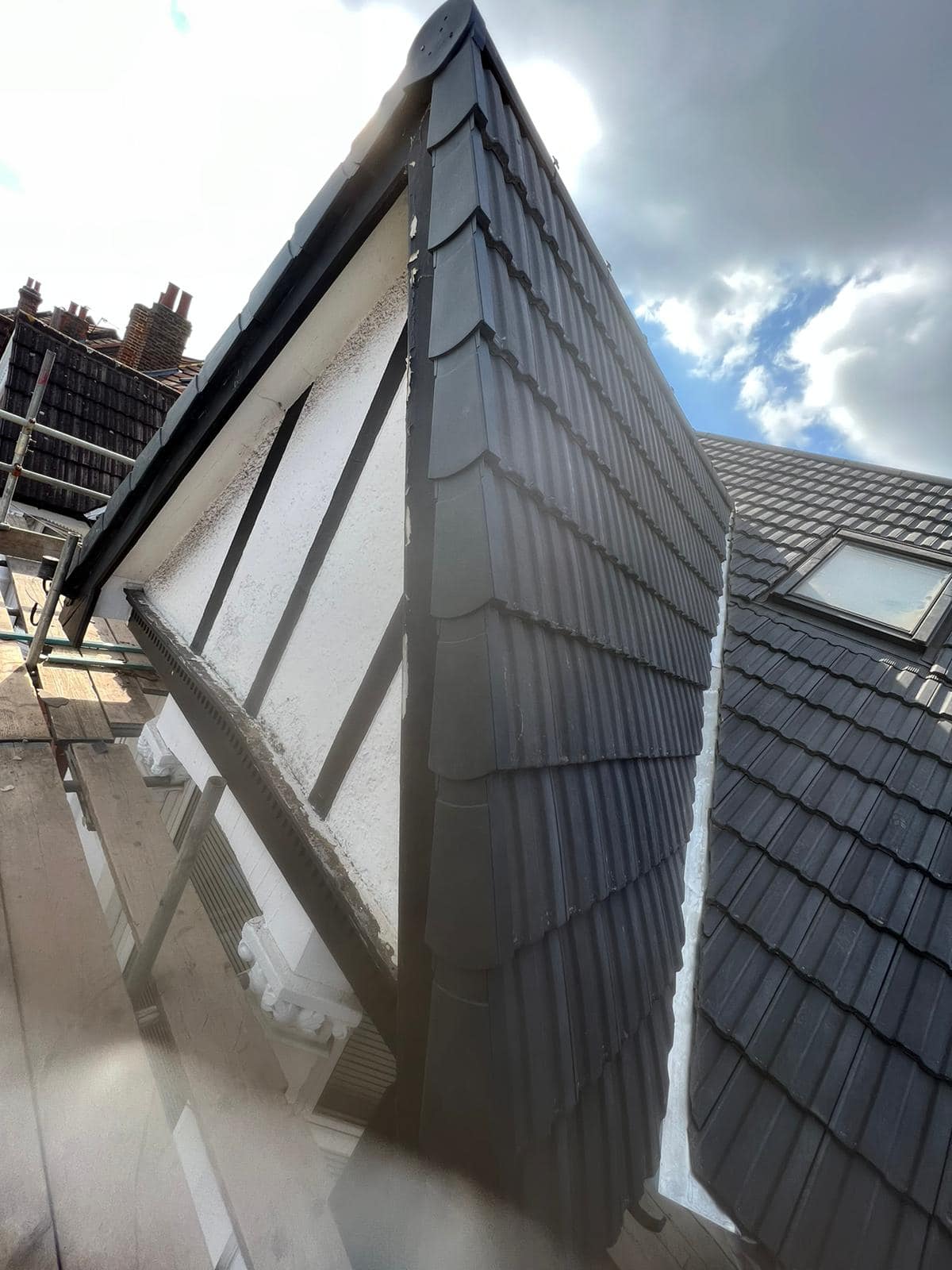 Professional roofers working on a property in London - KS Roof Master