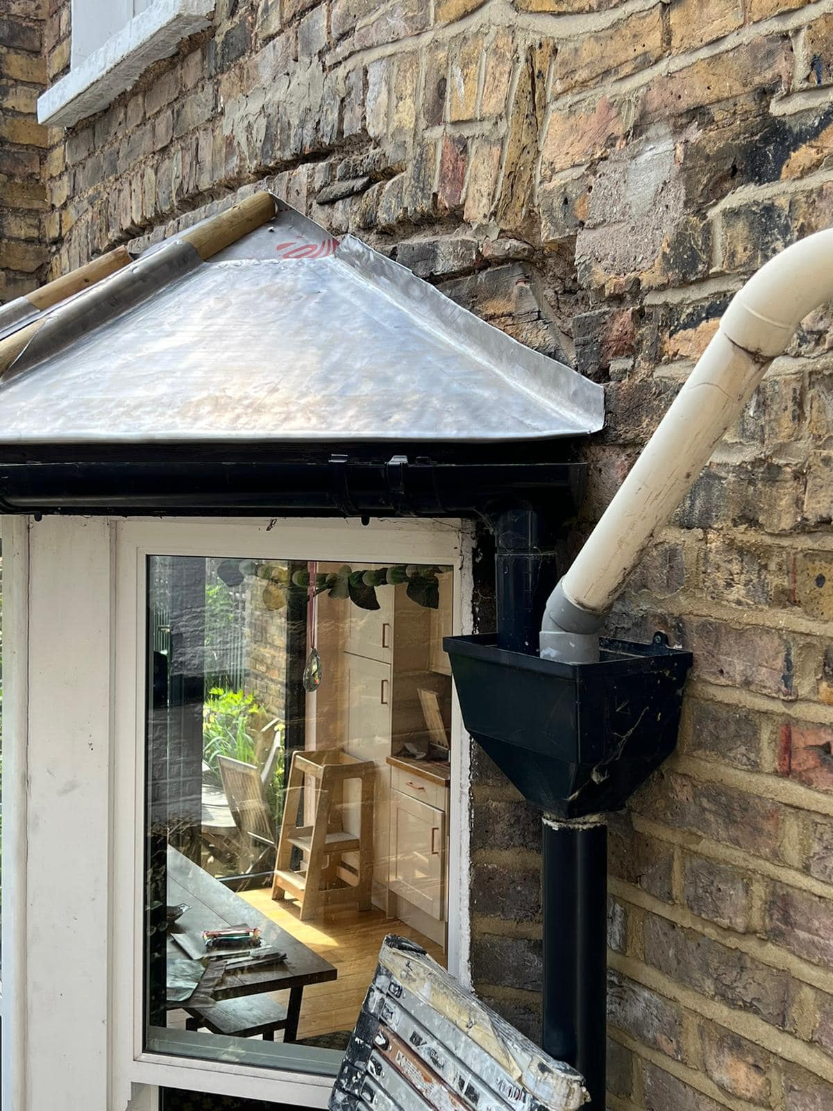 Professional roofers working on a property in London - KS Roof Master